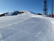 Perfectly groomed slope in the ski resort of Lagorai