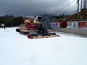Snow groomer at work in Jasná