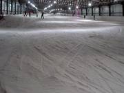 Groomed slope in the indoor ski hall