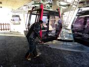 The platform of the gondola lift is being cleaned.