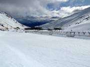 Gentle practice slopes with conveyor belts