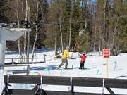 The bar on the drag lift is handed to you