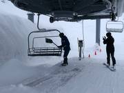 When it snows, the chairs are cleared of snow.