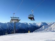Alblittkopfbahn chairlift with weather protection hoods
