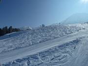 There is still space between the groomed slopes.