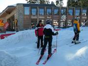 Staff assists with boarding at the platter lift