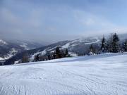 View from Wierch Pośredni to the slopes at Hala Skrzyczeńska