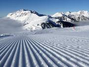 Perfectly groomed slope in the ski resort of Alpe Lusia