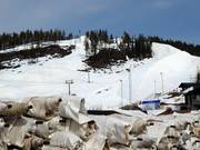The snow is preserved under tarpaulins over the summer.