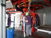 The staff assists with getting out of the gondola