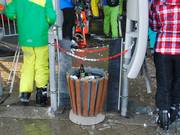 You will find waste bins at most lift entrances.