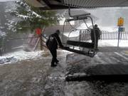 The staff cleans the seats in bad weather.