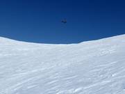 Untouched slopes await you when heliskiing