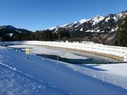 A storage pond provides the necessary water supply
