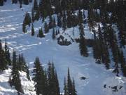 Steep mogul slope with rocks