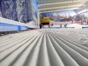 Perfect slope grooming at the indoor ski hall The Snow Centre