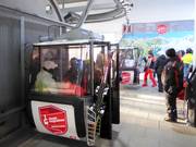 Staff is present when boarding the gondola lift.