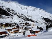 Snowmaking with snow guns on the valley slopes in Vent
