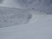 Powder slopes below the summit of Bjelašnica