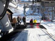 Staff is present at the chairlift.