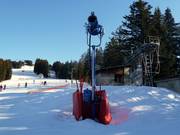 Snow cannon on the slope
