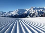 Perfectly groomed slopes in the Minschuns ski area