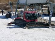 Waiting for action: snow groomer at the lift station