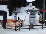 Staff are present at the boarding area of the tow lifts