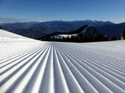 Perfectly groomed slopes in the ski resort of Monte Bondone