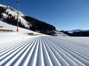 Perfectly groomed slope in the ski resort of Lagorai