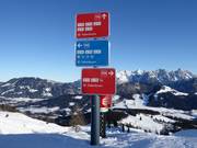 Signage with difficulty levels in color (blue=easy, red=intermediate, black=difficult)