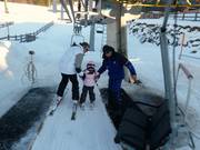 Small children are assisted when boarding