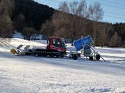 The snow groomer in the Rinn ski area