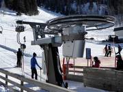 Service staff at the practice slope drag lift