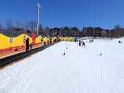 Tip for children  - Practice area at the moving carpet