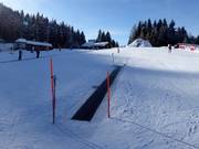 Practice area with moving carpets on the Reiteralm