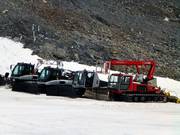 The snow groomers are waiting for their next assignment.