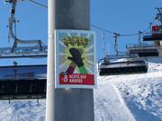 Snowpark rules as lift tower signs