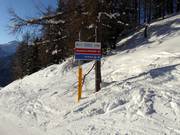 Signposting of slopes in the ski resort of Pejo