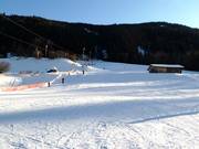 Easy slope at the ski lift in Trins
