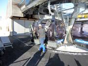 Assistance is provided when boarding the gondola lift.