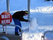 The employees build small snow sculptures