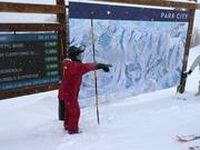 Staff at the slope map for questions