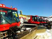 The snow groomers are waiting for their next assignment