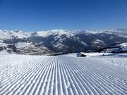 Perfectly groomed slope in the Obersaxen ski area