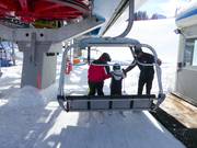 Small children are assisted when boarding