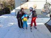 Small children are assisted when boarding
