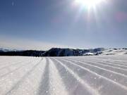 Perfectly groomed tracks await your first turns