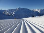 Freshly groomed slope in the Andermatt/Sedrun ski area