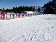 Practice area at the mountain station of the Loferer Alm Bahn II with covered conveyor belt